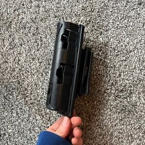 Retractable baton holder